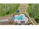 Aerial view of community pool, splash pad, playground, and dog park at 3532 Yarian Dr, Haines City, FL 33844