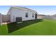 The spacious backyard features artificial turf for low-maintenance upkeep and privacy fencing at 3532 Yarian Dr, Haines City, FL 33844
