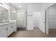 Bathroom featuring shower, granite vanity, and linen closet, plus door to bedroom at 3532 Yarian Dr, Haines City, FL 33844
