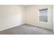 Simple bedroom with a large window at 3532 Yarian Dr, Haines City, FL 33844
