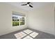 Bedroom with a ceiling fan, window view, and carpet flooring at 3532 Yarian Dr, Haines City, FL 33844