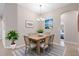 Cozy dining room featuring a wooden table with seating for six and decorative wall art at 3532 Yarian Dr, Haines City, FL 33844