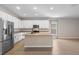 Spacious open concept kitchen with stainless steel appliances, granite counters, an island, and ample storage at 3532 Yarian Dr, Haines City, FL 33844