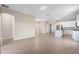 Spacious living area showcases a kitchen, dining, and living area with wood-look tile flooring at 3532 Yarian Dr, Haines City, FL 33844
