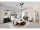 Serene primary bedroom with ample natural light, a ceiling fan, and a neutral color palette at 3532 Yarian Dr, Haines City, FL 33844