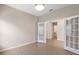 Bright office space featuring double doors and wood-look tile flooring, offering a modern, clean aesthetic at 3532 Yarian Dr, Haines City, FL 33844