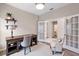 Functional home office space with a wooden desk, comfortable chair, and ample storage at 3532 Yarian Dr, Haines City, FL 33844