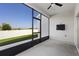 Patio with a screen enclosure, offering an unobstructed view of the green backyard and providing bug-free enjoyment at 3532 Yarian Dr, Haines City, FL 33844