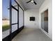 Covered patio with screened enclosure and ceiling fan, perfect for outdoor relaxation and entertainment at 3532 Yarian Dr, Haines City, FL 33844
