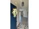 Inviting entryway with decorative front door, pendant lighting, and views into the living room at 377 Blue Bayou Dr, Kissimmee, FL 34743