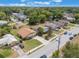 Charming neighborhood view of a single story home surrounded by lush greenery and mature trees at 3823 Martin St, Orlando, FL 32806