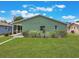 Beautiful backyard with a well-manicured lawn and charming landscaping at 3823 Martin St, Orlando, FL 32806