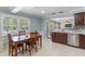 Inviting eat-in kitchen with tile floors, stainless steel appliances, and natural light at 3823 Martin St, Orlando, FL 32806