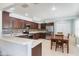 Well-lit kitchen with modern appliances, spacious countertops, and a charming dining table at 3823 Martin St, Orlando, FL 32806