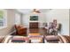 Spacious living room with hardwood floors, ceiling fan, a TV and comfortable seating at 3823 Martin St, Orlando, FL 32806