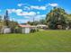 Well-maintained backyard featuring a small shed and green lawn at 3823 Martin St, Orlando, FL 32806