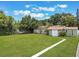 Well-maintained backyard with a cute shed and green lawn at 3823 Martin St, Orlando, FL 32806