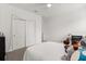 Bright bedroom features neutral walls, soft lighting, and ample closet space for organized storage at 4216 Jespersen St, Apopka, FL 32712