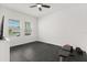 Bright bedroom with ample natural light, and an exercise area with a bench and weights at 4216 Jespersen St, Apopka, FL 32712
