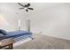 Bright, carpeted bedroom with neutral walls and ceiling fan offers a comfortable and spacious atmosphere at 4216 Jespersen St, Apopka, FL 32712