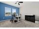 Spacious home office features ample natural light, modern desk setup, and sleek storage options at 4216 Jespersen St, Apopka, FL 32712