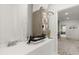 Picture showcasing a utility closet with its equipment, as well as a hallway with a light fixture and carpeted floor at 4216 Jespersen St, Apopka, FL 32712