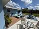 Beautiful backyard with a patio, lounge chairs, and dining area, perfect for outdoor entertaining and relaxation at 4382 Sw 171St Pl, Ocala, FL 34473
