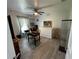 Versatile bedroom with wood-look floors, a ceiling fan, and a modern glass display case, optimizing space and style at 4382 Sw 171St Pl, Ocala, FL 34473