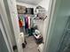 Neat closet with shelving, hanging rods, and overhead storage, providing ample space for clothes and belongings at 4382 Sw 171St Pl, Ocala, FL 34473