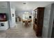 Open concept dining area with chandelier, wood table, and chairs adjacent to kitchen at 4382 Sw 171St Pl, Ocala, FL 34473