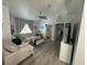 Cozy living room featuring comfortable seating, neutral tones, ceiling fan and modern flooring at 4382 Sw 171St Pl, Ocala, FL 34473
