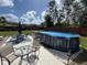 Relaxing backyard with covered pool, patio and outdoor furniture, perfect for entertaining at 4382 Sw 171St Pl, Ocala, FL 34473