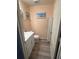 Cozy half bath with white vanity, storage cabinet, and neutral paint at 439 Sunfish Dr, Winter Haven, FL 33881