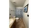 Well maintained bathroom features a granite vanity, framed mirror, tile floors and shower with tub combination at 439 Sunfish Dr, Winter Haven, FL 33881