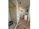 The bathroom features a tile shower, white cabinets and drawers for storage at 439 Sunfish Dr, Winter Haven, FL 33881