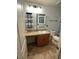 Cozy bathroom features a granite vanity, framed mirror, tile floors and shower with tub combination at 439 Sunfish Dr, Winter Haven, FL 33881