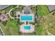 Aerial view of the community pool and playground in a well-maintained setting at 439 Sunfish Dr, Winter Haven, FL 33881