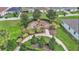 Aerial view of a community playground surrounded by lush landscaping at 439 Sunfish Dr, Winter Haven, FL 33881