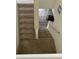 Carpeted stairs provide access to the upper and lower floors of the home at 439 Sunfish Dr, Winter Haven, FL 33881