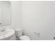 A well-lit bathroom features a classic white toilet and sink, creating a clean and functional space at 4545 Cross Prairie Pkwy, St Cloud, FL 34772