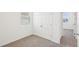 Bedroom with plush carpeting, a double door closet, and bright white trim and paint at 4545 Cross Prairie Pkwy, St Cloud, FL 34772