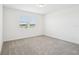 Bright bedroom with a window overlooking a serene view and neutral carpet at 4545 Cross Prairie Pkwy, St Cloud, FL 34772