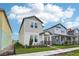 Modern two-story home showcasing light siding and a well-maintained front lawn at 4545 Cross Prairie Pkwy, St Cloud, FL 34772