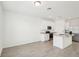 Spacious kitchen with granite countertops, stainless appliances, white cabinets, and an open layout at 4545 Cross Prairie Pkwy, St Cloud, FL 34772