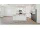 Well-equipped kitchen featuring white cabinets, granite countertops, and stainless steel appliances at 4545 Cross Prairie Pkwy, St Cloud, FL 34772