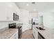 Modern kitchen with white cabinets, granite countertops, stainless appliances, and a spacious island at 4545 Cross Prairie Pkwy, St Cloud, FL 34772