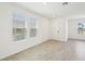 Bright living room featuring neutral tile floors, ample natural light, and a welcoming atmosphere at 4545 Cross Prairie Pkwy, St Cloud, FL 34772