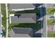 Aerial view of modern homes with dark roofs and manicured lawns in a suburban neighborhood at 4875 Lacewing Dr, Winter Garden, FL 34787