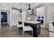 Modern kitchen features white cabinets, stainless steel appliances, and a dark central island at 4875 Lacewing Dr, Winter Garden, FL 34787