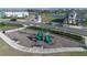 Community playground with slides, swings, and seating areas, perfect for outdoor fun at 4875 Lacewing Dr, Winter Garden, FL 34787